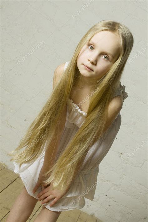 teen girl fashion model with long blond hair natural
