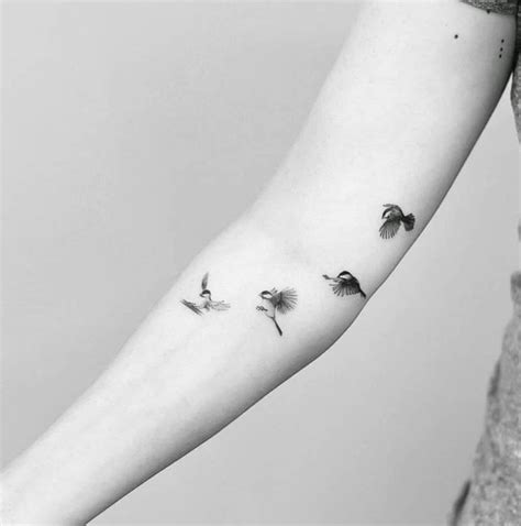 flying black capped chickadee sequence tattoo