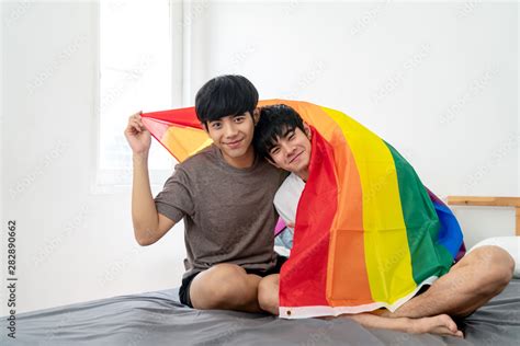 Portrait Of Asian Gay Couple Smiling On Face Looking At Camera
