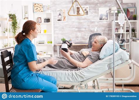 old woman laying on bed in nursing home stock image image of nurse