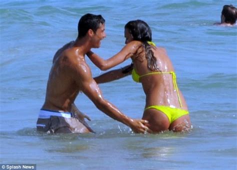 cristiano ronaldo can t keep his hands off irina shayk s derriere as the couple frolic in the