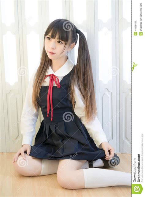 japanese style cute school girl indoor home woman stock