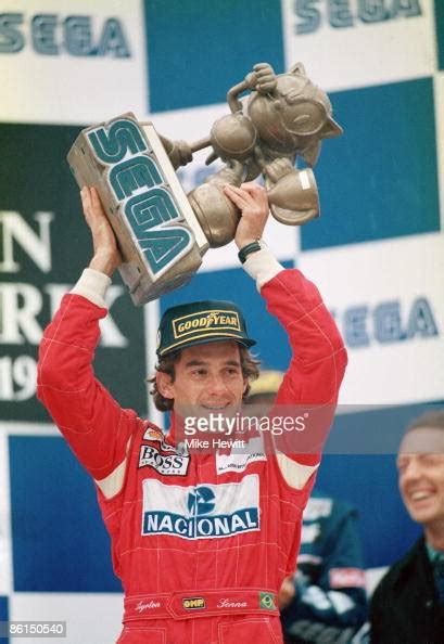 Brazilian Racing Driver Ayrton Senna With The Trophy After Winning