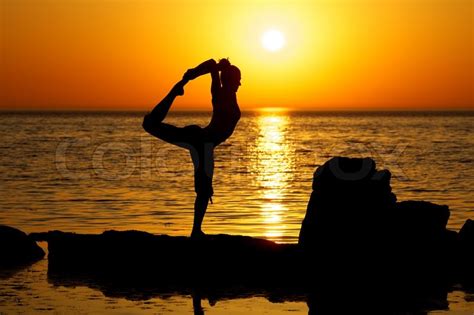 yoga  sunset stock photo colourbox