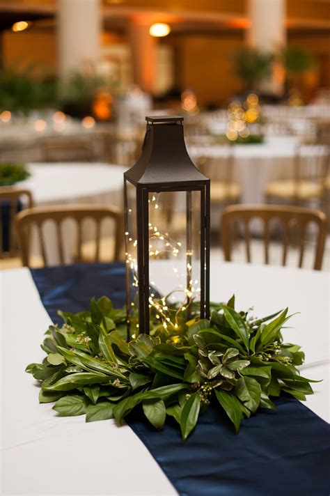 lantern centerpiece  simple greenery