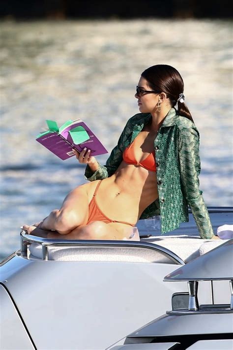 kendall jenner rocks an orange bikini while relaxing on a luxury boat