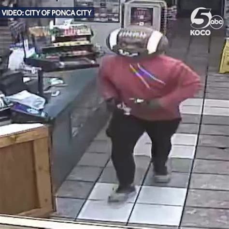 Armed Robbery Suspect Caught On Camera Wearing Football Head Mask