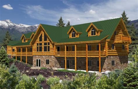 large log home  lots  windows  green roofing  top