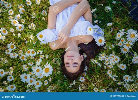 Beautiful Woman Enjoying Daisy Field Nice Female Lying Down In Meadow