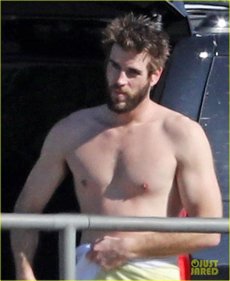 Shirtless Liam Hemsworth Shows Off His Muscles At The