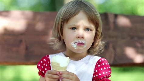 lovely person enjoys ice cream on bench stock footage sbv 304879862
