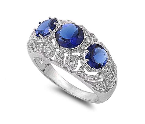 Round Blue Simulated Sapphire Cubic Zirconia Three Stones Filigree Ring