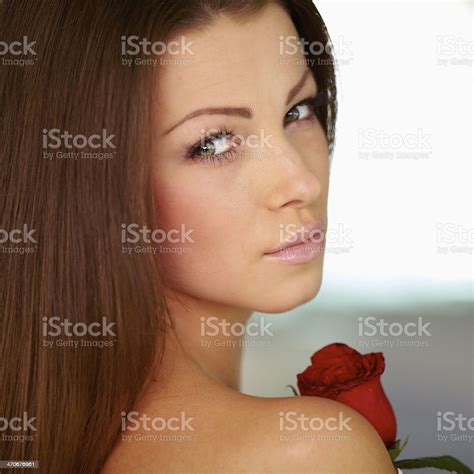 portrait   lovely young woman  red rose stock photo