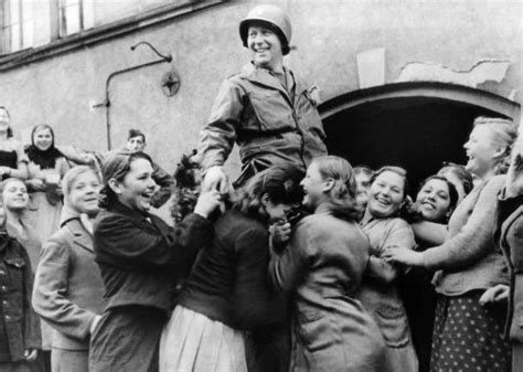 1944 lt j b keeley of houston texas is raised by ukrainian girls in celebration of their