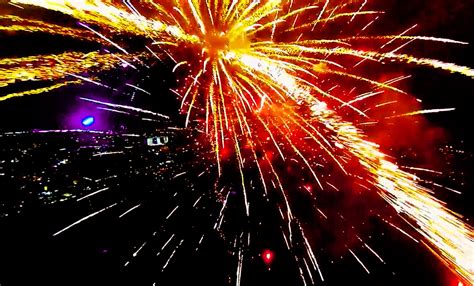 arial videographer flies  drone  exploding fireworks