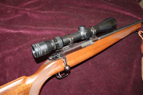 22 bolt action rifle by ruger with sound mod and 3 9x40 scope