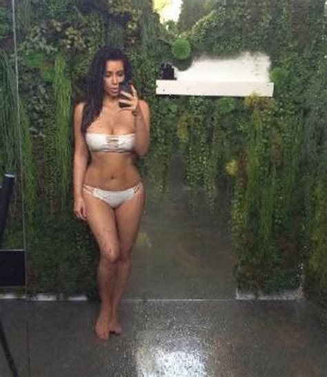 kim kardashian shows off pin up figure in skimpy bikini
