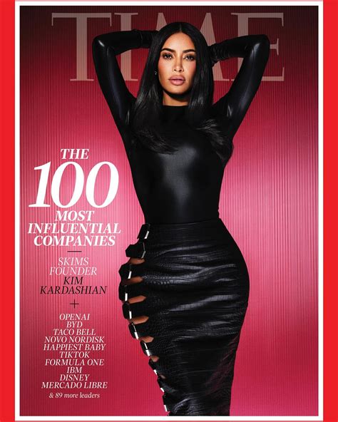 kim kardashian shows off her curves in skintight black bodysuit and cut