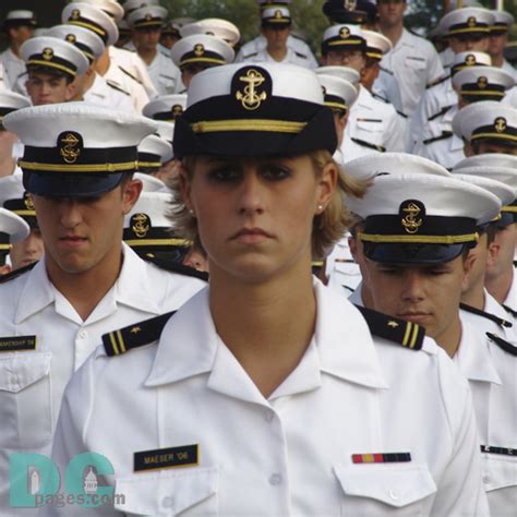 female naval academy cadet marches onto navy marine corps memorial stadium