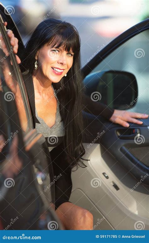 beautiful woman exiting vehicle stock image image  outdoor black