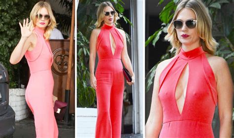 january jones flashes major sideboob and nipples as she squeezes curves into chic jumpsuit