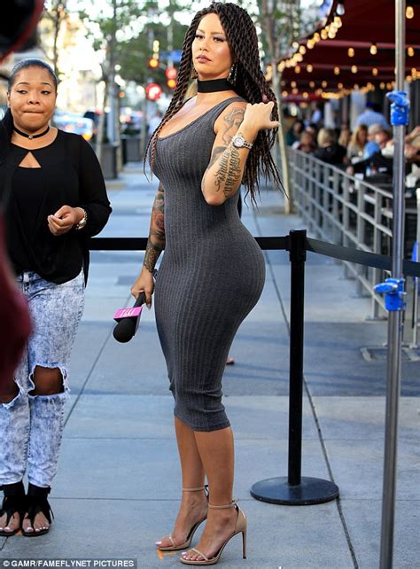 amber rose showcases her wig while flaunting her bountiful