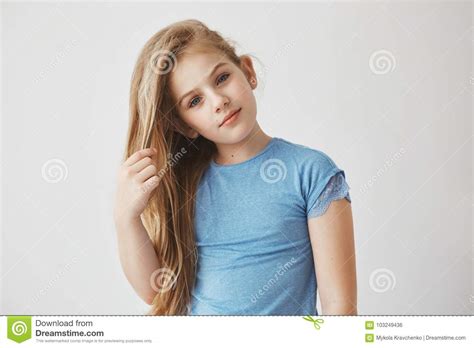 close up portrait of beautiful little blonde girl with
