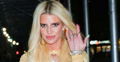 jessica simpson pours curves into tiny string neon bikini for full glam