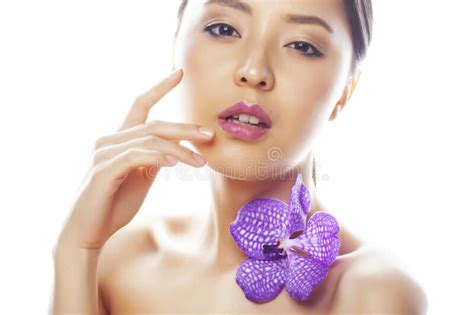 young pretty asian woman  flower purple orchid isolated  white