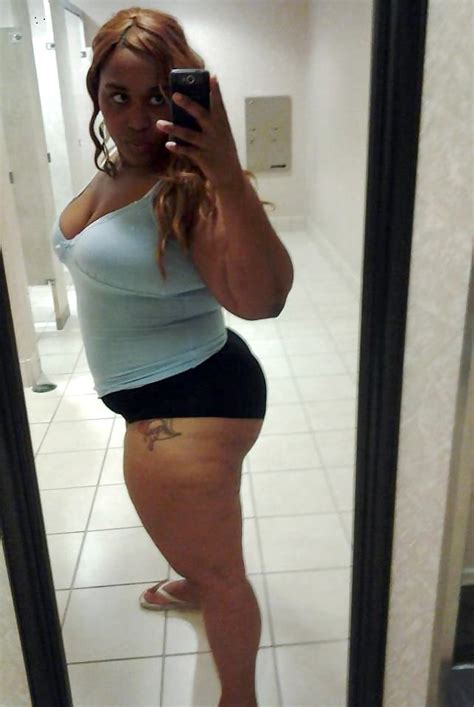 chubby ebony lady making pose while taking her selfie inside room ghetto tube