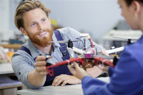 technician repairing quadrocopter drone stock photo image  table renovation