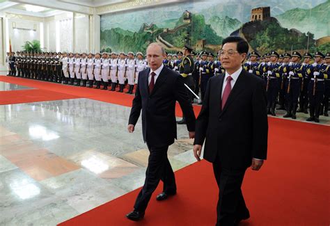 putin arrives in china for regional talks the new york times