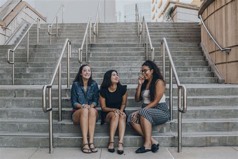 Three Women Smiling While Sitting On Stairs Pixeor – Large Collection