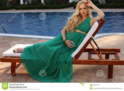 Beautiful Pregnant Woman With Blond Hair In Elegant Dress