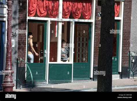 Prostitutes Advertising Their Wares In The Amsterdam Red Light Stock