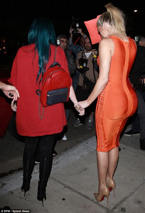 khloe kardashian shows off curvaceous figure in a clinging orange