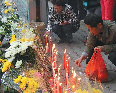 Residents Mourn In Urumqi On Friday For Victims Of The