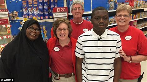 teen shown how to tie a tie by a target employee lands