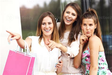 Group Of Girlfriends Shopping In The City With Credit Card 15813736