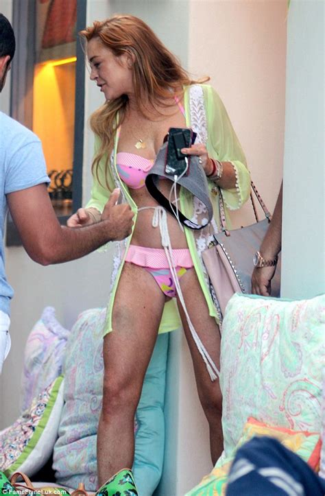 Lindsay Lohan Wears Pink Bikini As She Cosies Up To Two Males On