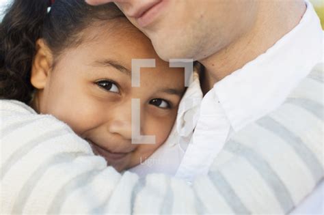 A Father And Daughter Snuggling — Photo — Lightstock