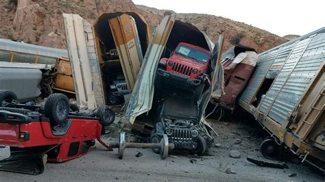 freight train derailment destroys dozens  jeep gladiator  gm