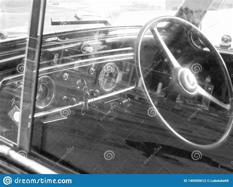 dashboard of a classic vintage car with reflections nostalgia concept