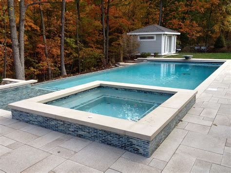 grand rapids modern infinity edge pool attached spa outdoor kitchen