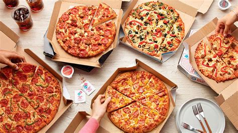 dominos pizza inauguro su tienda numero  en el pais  espera abrir