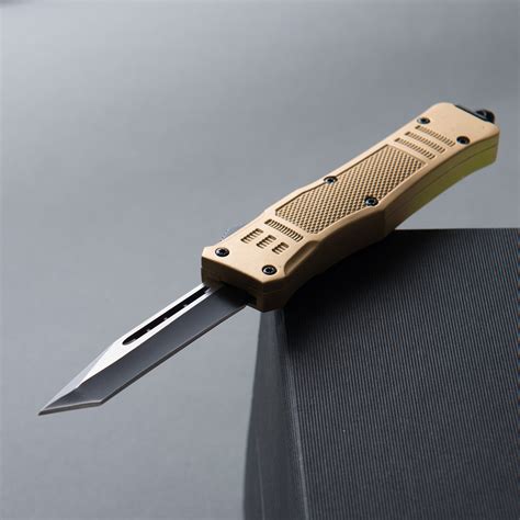 mini nemesis otf tactical knife  serrated raven crest tactical touch  modern