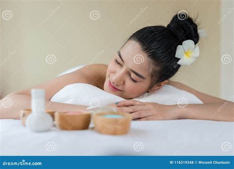 beautiful asian girl smile relaxing   spa massage stock photo