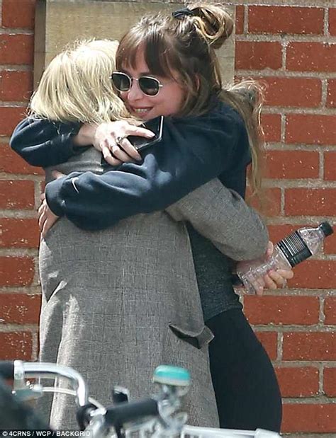 Dakota Johnson Wraps Her Pal In Full Body Hug In La