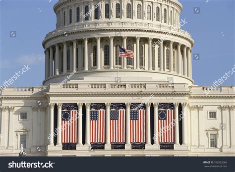 capitol building draped   flags washington dc stock photo