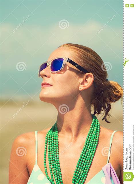 Beautiful Tanned Blond Woman On The Beach Sunbathing Stock